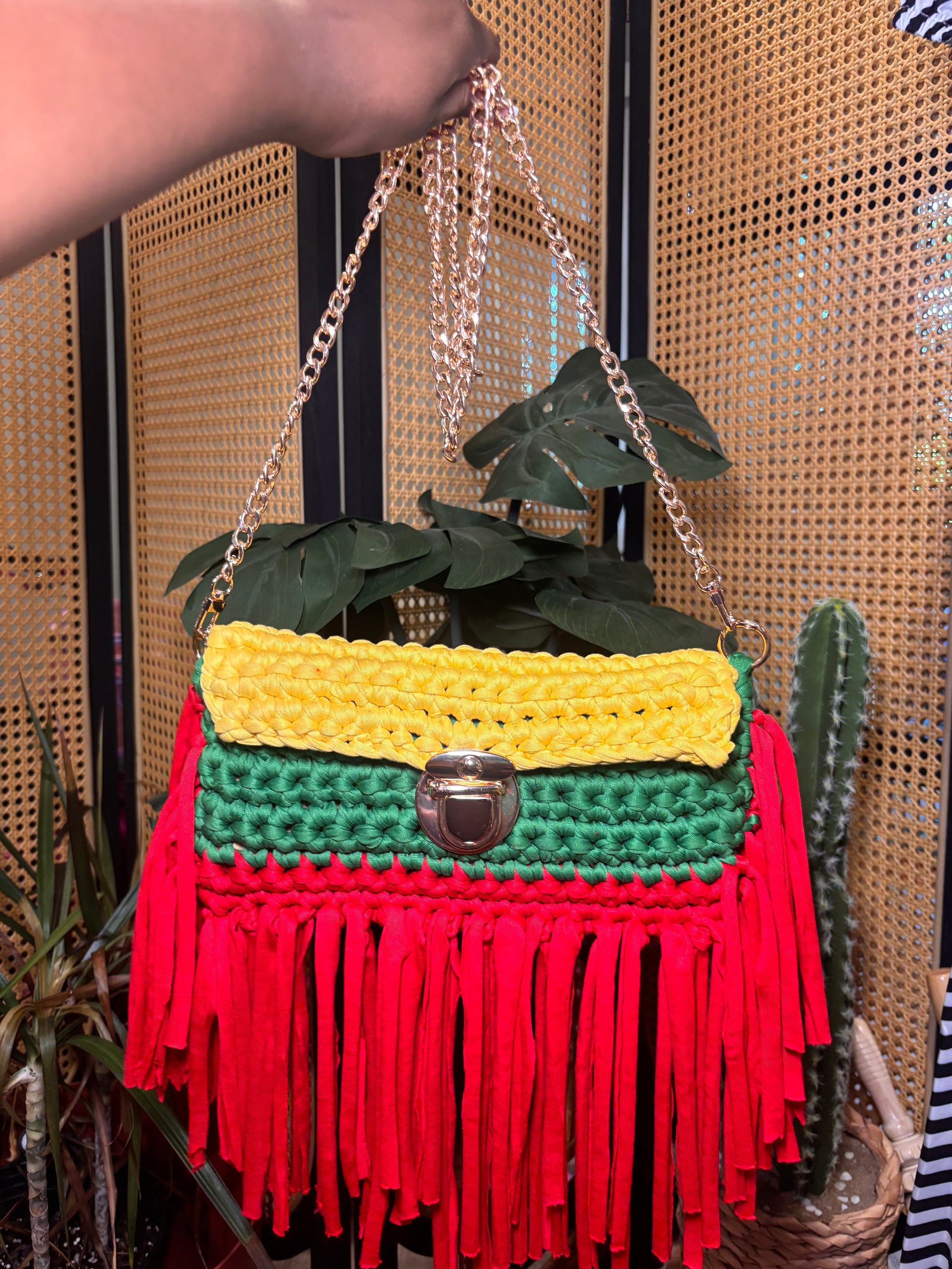 Handmade yellow, black and green crochet clutch with gold chain strap